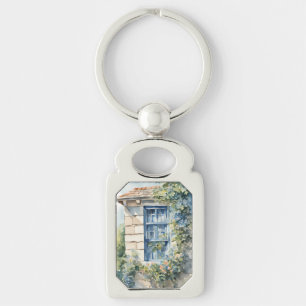 Llavero Casa de piedra con ventana azul y enredaderas