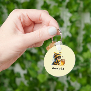 Llavero Chica lindo con traje de abeja con miel