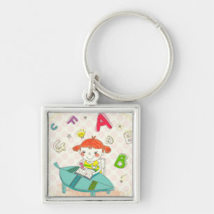 Llavero Chica que se sienta en la silla, estudiando