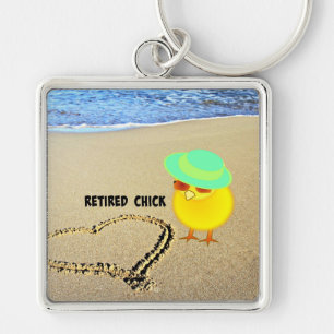 Llavero Chica retirada en la playa