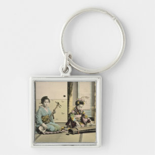 Llavero Chicas japoneses que juegan la flauta, el "koto" y