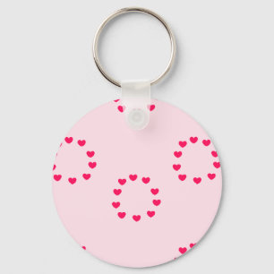 Llavero círculos de corazón rojo sobre rosa