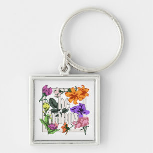 Llavero Cita positiva Be Happy y flores de jardín