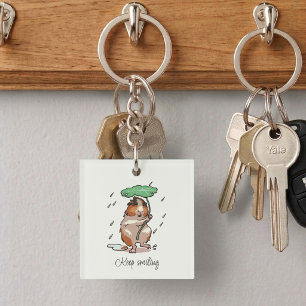 Llavero Cobaya Feliz Mantén la Sonrisa Disfrutando de la L