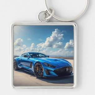 Llavero Coche deportivo azul elegante bajo un cielo nublad