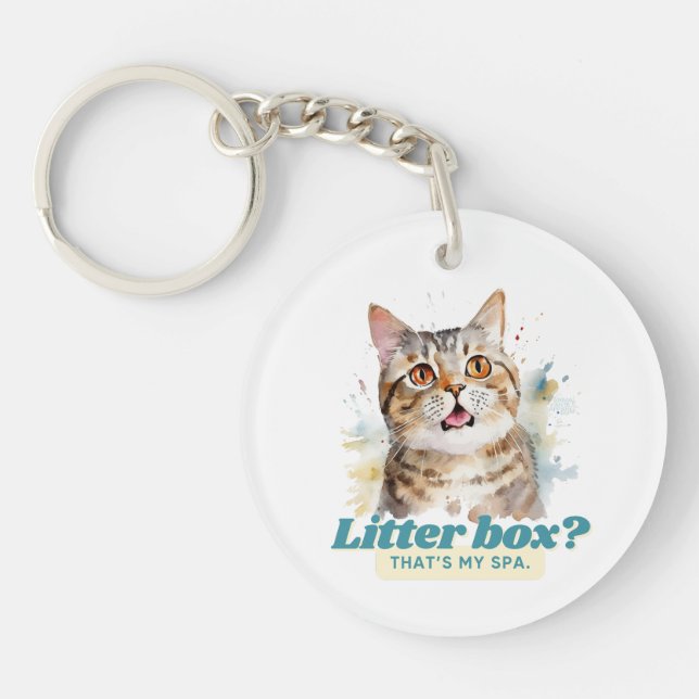 Llavero Comical Kitty "Litter Box? Ese es mi spa" (Frente)