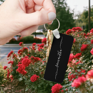 Llavero Corazón negro y blanco con floritura de firma Nomb