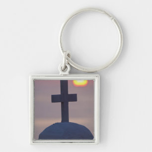 Llavero Cruz en lo alto de la iglesia al atardecer, Mykono