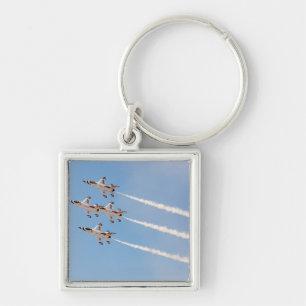 Llavero Cuatro F-16 Thunderbirds vuelan en formación cerra