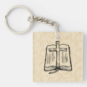 Llavero de acrílico con Biblia y cruz dibujadas a
