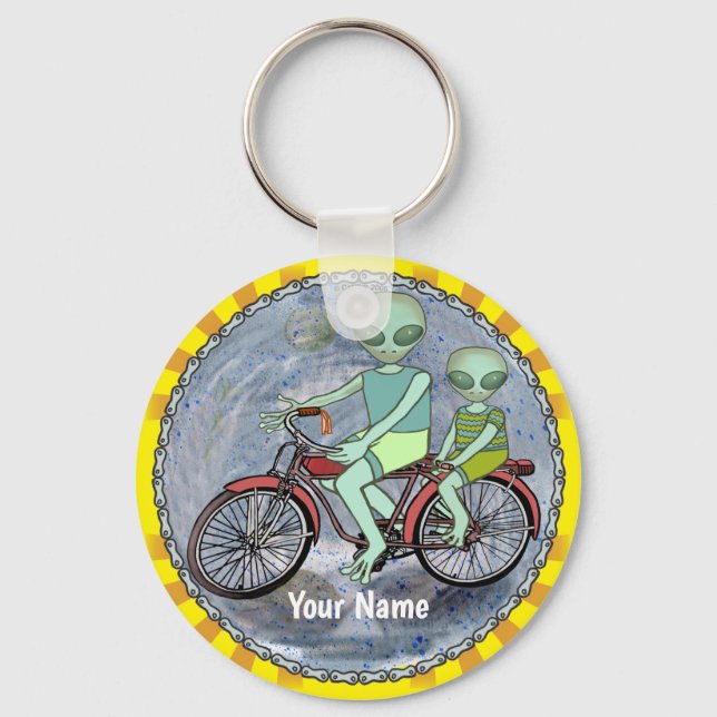 Llavero de alienígena montando bicicleta (Anverso)