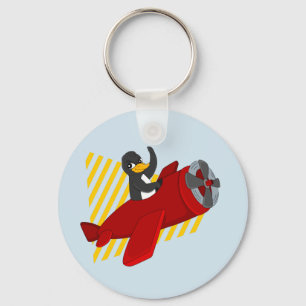 Llavero de dibujo animado de pingüino volando