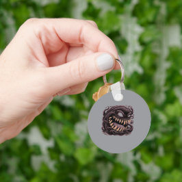 Llavero de Monstruo Alienígena con Símbolo Oscuro