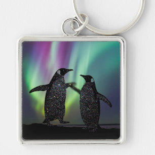 Llavero de pingüinos con hermoso diseño de aurora
