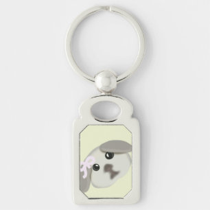 Llavero de plata con arte de cachorro blanco lindo