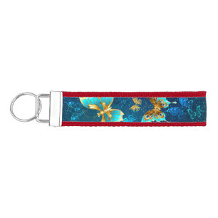 Llavero De Pulsera Mariposas doradas sobre fondo azul
