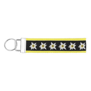 Llavero De Pulsera Negro y Amarillo con Flores Edelweiss Blancas
