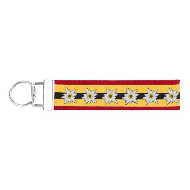 Llavero De Pulsera Rojo, amarillo y negro con flores de edelweiss bla (Llaves lado izquierdo)