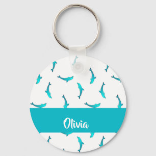 Llavero delfines azules sobre blancos