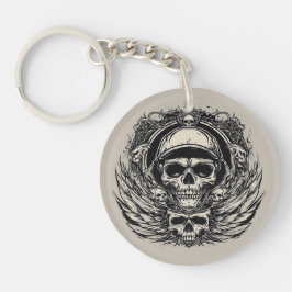 Llavero Diseño de cráneo con alas y símbolos