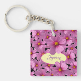 Llavero Diseño de flores moradas de cosmos en un fondo neg