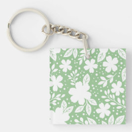 Llavero Diseño floral blanco sobre fondo verde suave