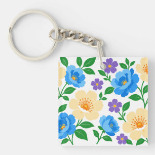 Llavero Diseño floral con flores azules, crema y púrpura