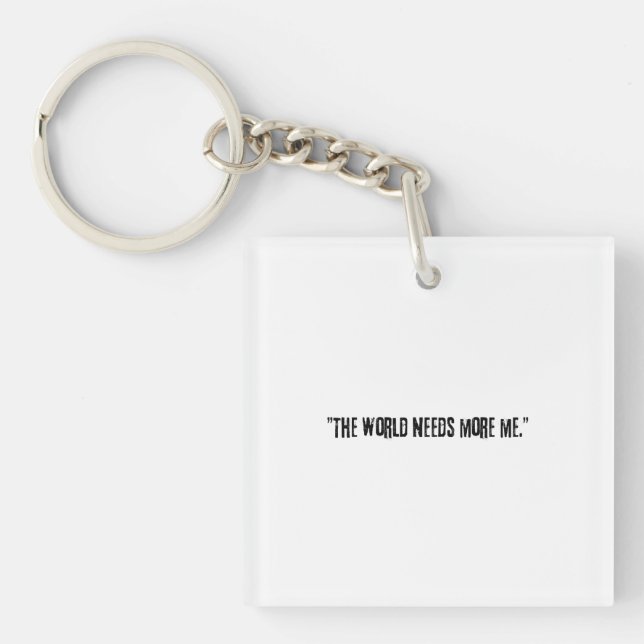 Llavero Distressed Black Text "THE WORLD NEEDS MORE ME" on (Frente)