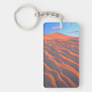 Llavero Dunas de Dumont, dunas de arena y nubes