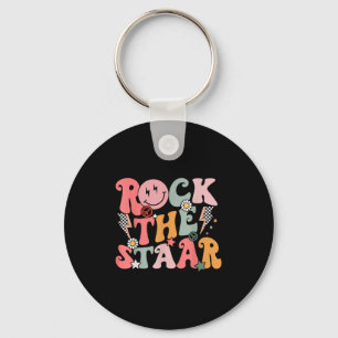 Llavero El divertido Groovy Testing Day Rock The Staar Mot