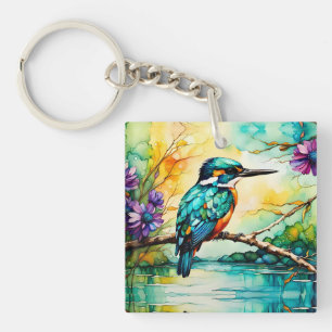 Llavero El Kingfisher sobre el agua y las flores silvestre