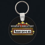 Llavero El mayor cirujano del mundo<br><div class="desc">Los mayores Camisetas, ropa y regalos de cirujano del mundo son la ocupación ideal y los regalos de reconocimiento a los empleados además de regalos para todas las ocasiones. Este singular diseño de marquesina muestra la ocupación y la profesión rodeadas de luces de neón y estrellas. Disponible en tazas, imanes,...</div>