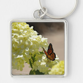 Llavero El monarca y las flores