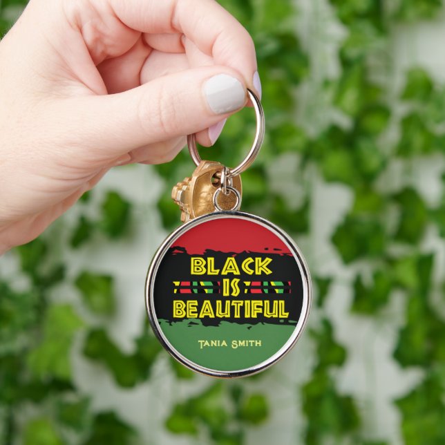 Llavero El negro es un regalo hermoso, el nombre personali (Mano)