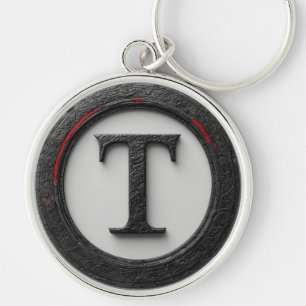 Llavero 🔴 Emblema de monograma T de metal negro 🔴