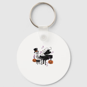 Llavero Esqueleto espeluznante tocando el piano con gatos
