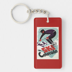 Llavero Esquiador negro y púrpura vestido