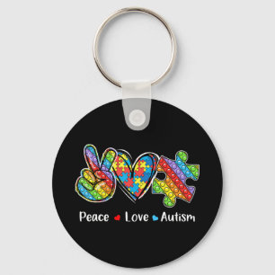 Llavero Este tejo con mano de paz, forma cardíaca y pop es