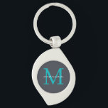 Llavero Estilis y monogramado personalizado<br><div class="desc">Añada un toque de sofisticación a sus llaves con nuestra Elegante Keychain Inicial del Monograma Gris y Azul. Con un elegante fondo gris, un sorprendente monograma inicial azulado y su nombre elegantemente mostrado sobre el monograma, esta cadena de claves es perfecta para añadir un toque personalizado a sus necesidades básicas...</div>