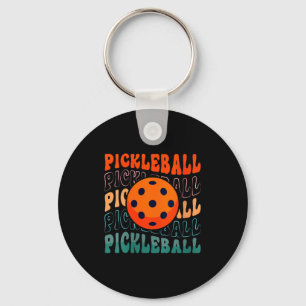 Llavero Estilo retro de pickleball femenino agitando con u
