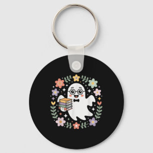 Llavero Fantasma sosteniendo libros rodeado de flores de o