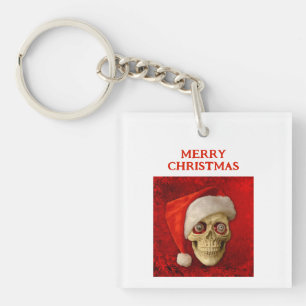 Llavero Feliz Navidad. Calavera con sombrero de Santa