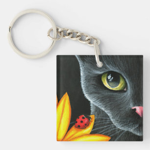 Llavero Flor amarilla del gato negro 510