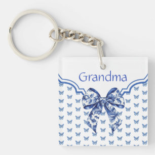 Llavero Flor blanca de mariposa azul vintage personalizada