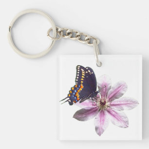 Llavero Flor de clematis y mariposa de cerda negra