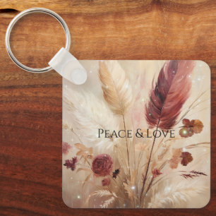 Llavero Flor de plumas de crema roja