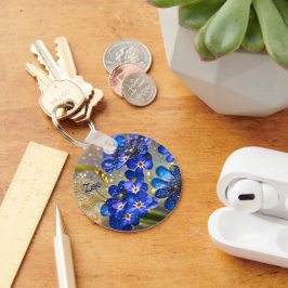 Llavero Flor olvidadiza con acentos dorados