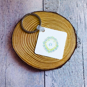 Llavero Flor y monogramas pasteles multicolores