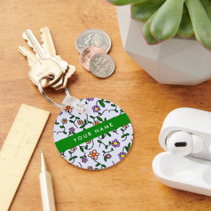 Llavero Flores de colores, fondo azul, verde