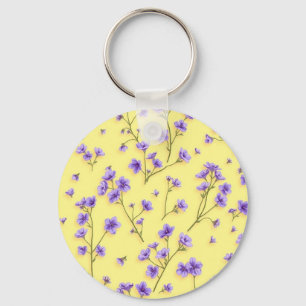 Llavero Flores moradas delgadas sobre fondo amarillo
